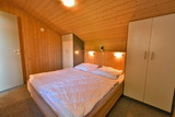 Ferienhaus in Pelzerhaken - Ferienhaus Typ C im Ferienpark AM WALDRAND - Schlafzimmer mit Doppelbett